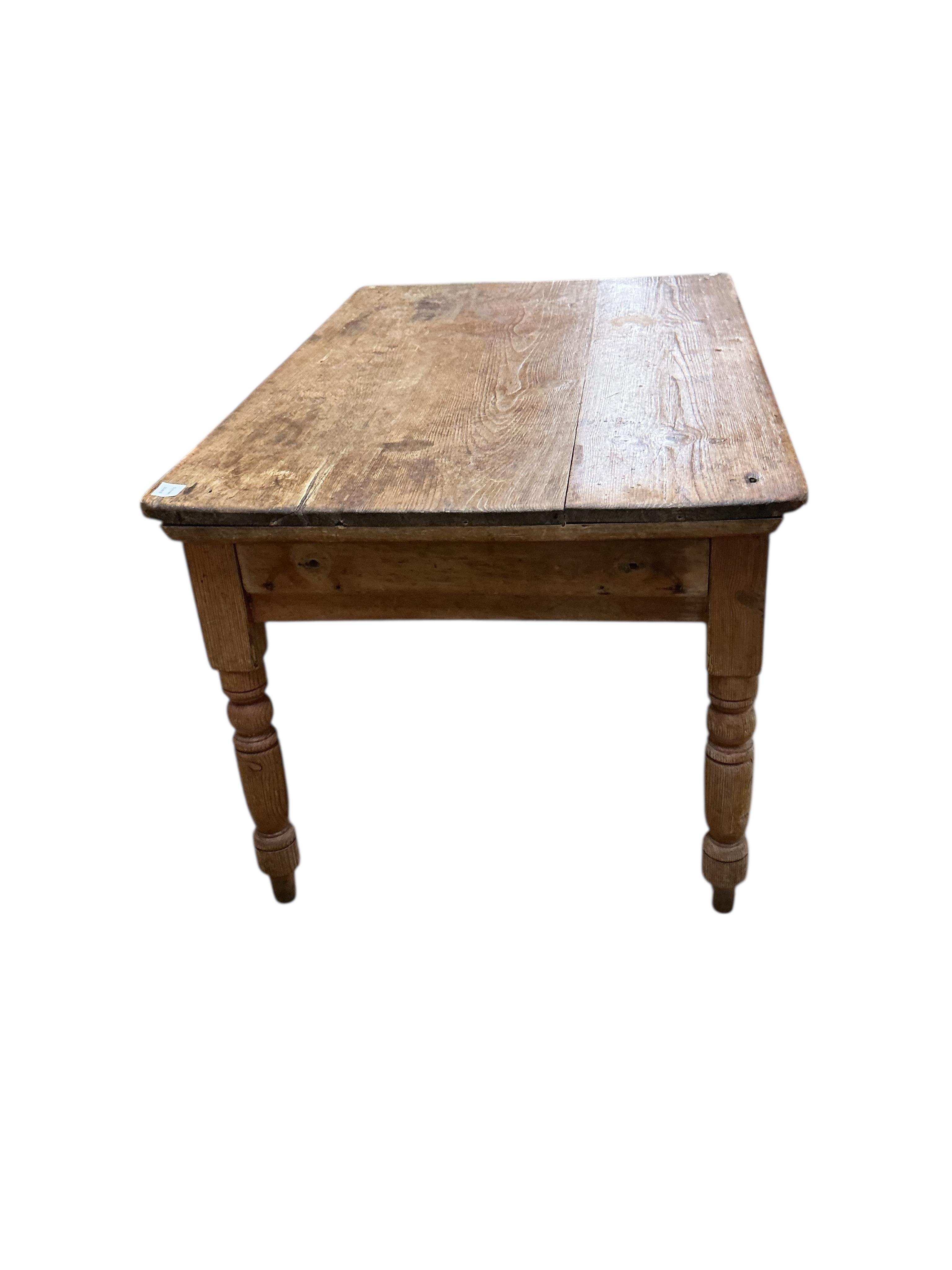 A Victorian rectangular pine kitchen table, width 133cm, depth 82cm, height 72cm together with four Victorian Windsor elm and beech comb back kitchen chairs